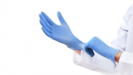 Person wearing latex gloves